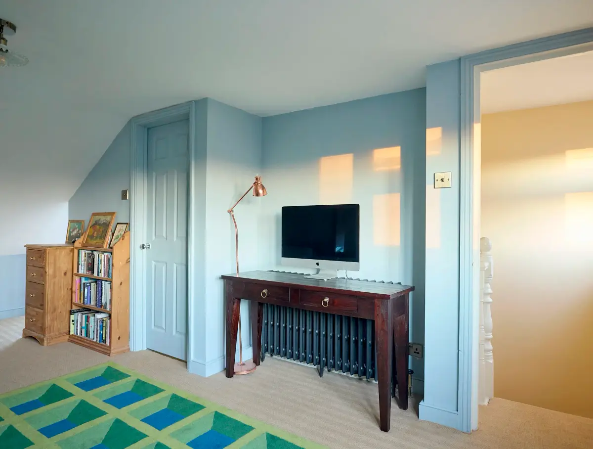 Bathroom detail — gold taps and antique accessories